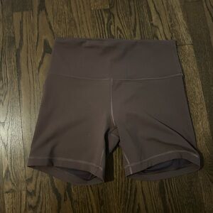 Like new Lululemon biker shorts size 10
Brown / taupe color 
Logo on back